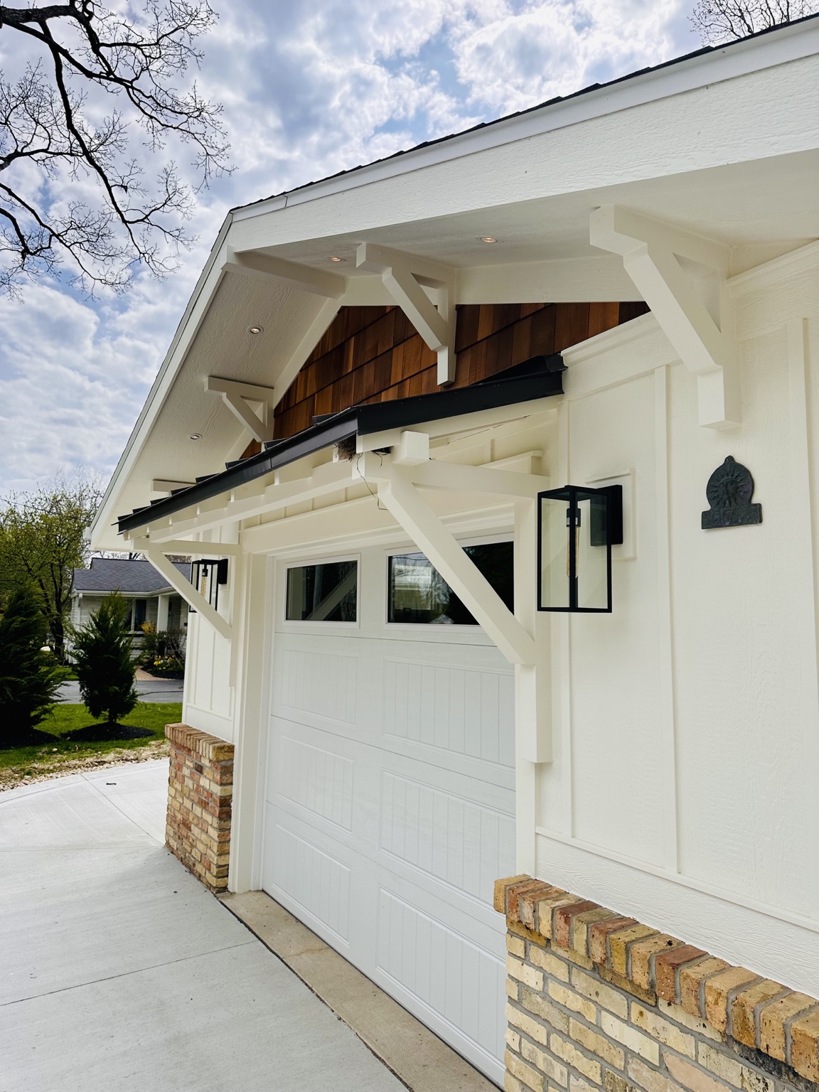 Bahrke Built exterior with handcrafted brackets, cedar accents and brick details